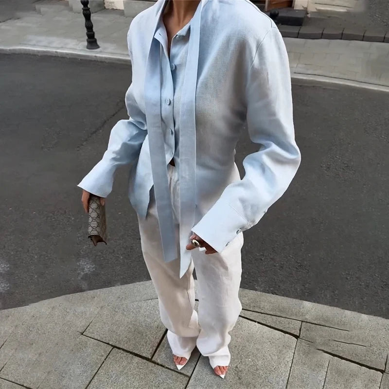 Chemise femme élégante à col noué et manches longues