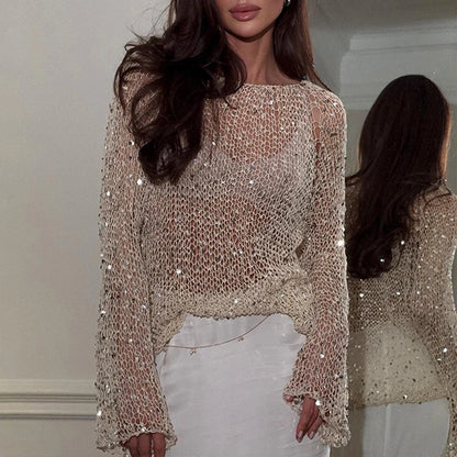 Pull femme en maille ajourée à col rond et manches évasées