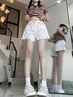 Short en jean blanc déchiré pour femmes
