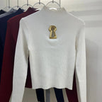 Pull tricoté ajouré à col mi-haut à manches longues pour femmes
