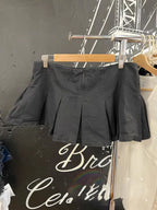 Mini-jupe plissée noire taille basse pour femmes