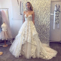 Robe de mariée longue élégante sans manches en tulle à volants pour femmes