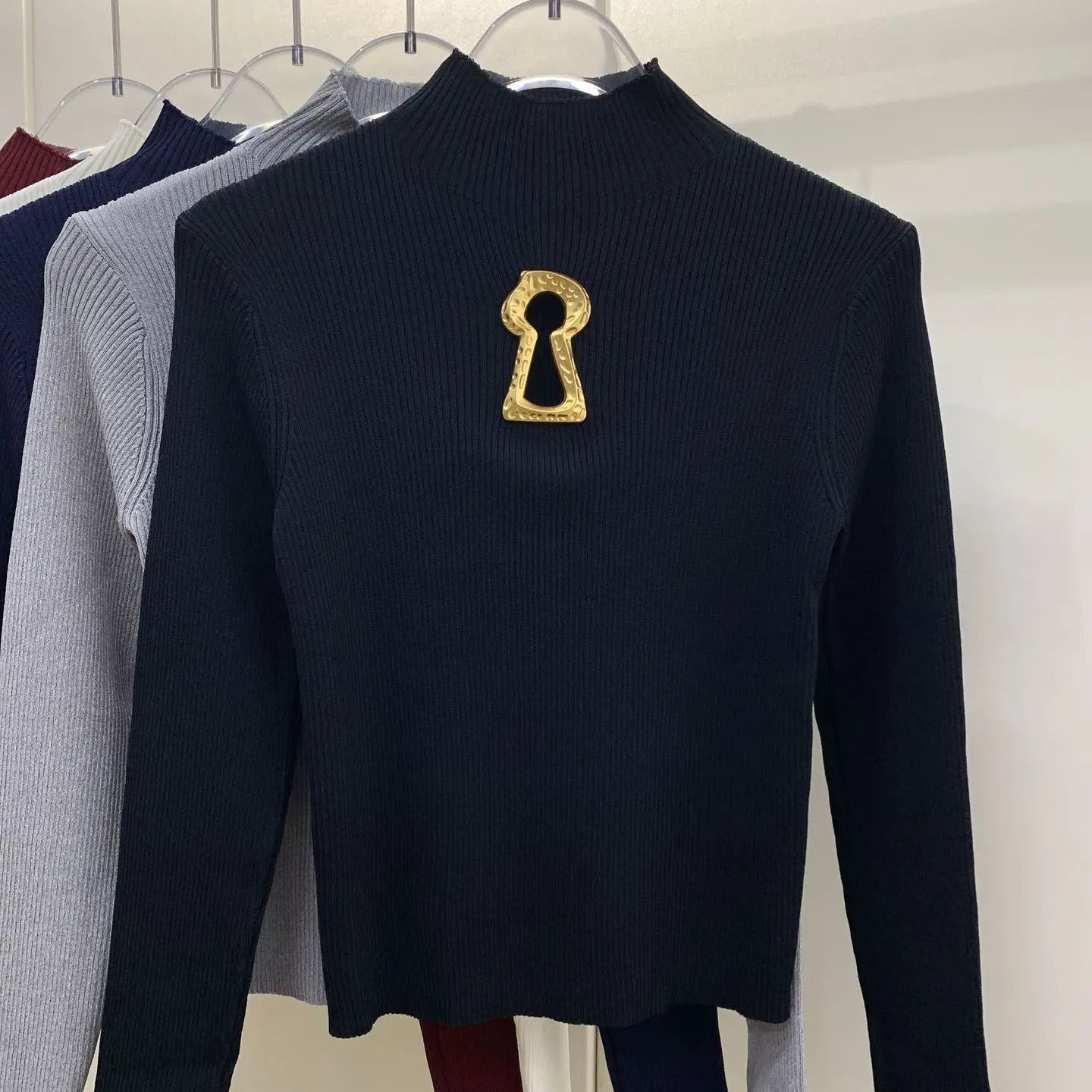 Pull tricoté ajouré à col mi-haut à manches longues pour femmes