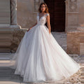 Robe de mariée de bal luxueuse ornée de perles pour femmes