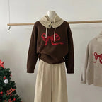 Pull brodé avec nœud pour femmes