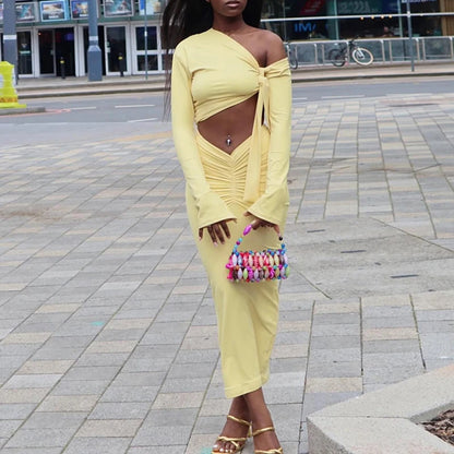 Ensemble femme haut asymétrique et jupe longue froncée